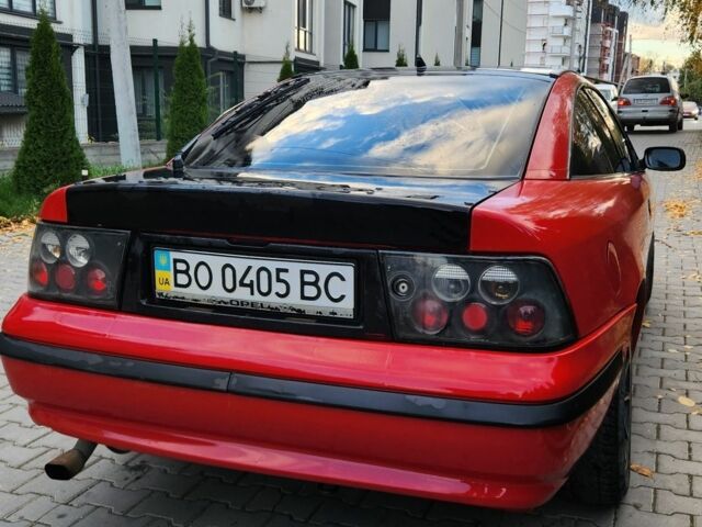 Червоний Опель Калібра, об'ємом двигуна 2 л та пробігом 200 тис. км за 1850 $, фото 4 на Automoto.ua