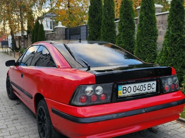 Червоний Опель Калібра, об'ємом двигуна 2 л та пробігом 200 тис. км за 1850 $, фото 2 на Automoto.ua