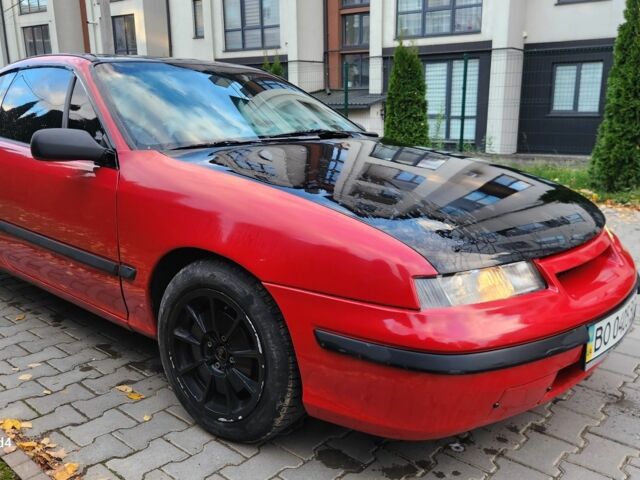 Червоний Опель Калібра, об'ємом двигуна 2 л та пробігом 200 тис. км за 1850 $, фото 3 на Automoto.ua