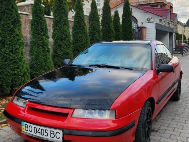 Червоний Опель Калібра, об'ємом двигуна 2 л та пробігом 200 тис. км за 1850 $, фото 1 на Automoto.ua