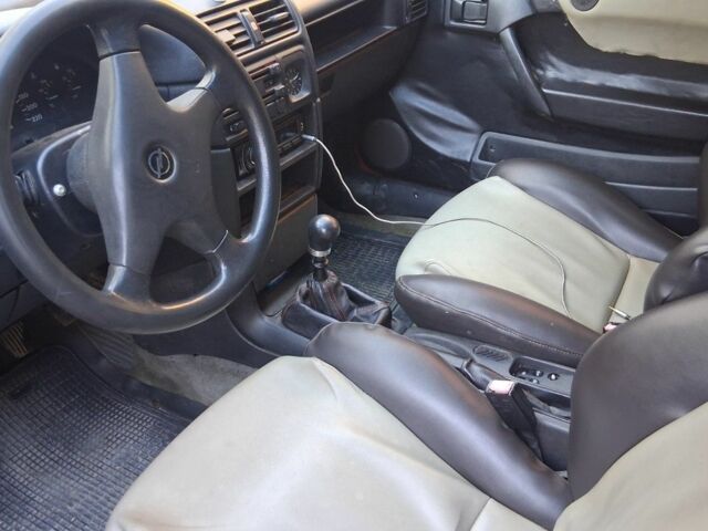 Червоний Опель Калібра, об'ємом двигуна 2 л та пробігом 200 тис. км за 1850 $, фото 6 на Automoto.ua