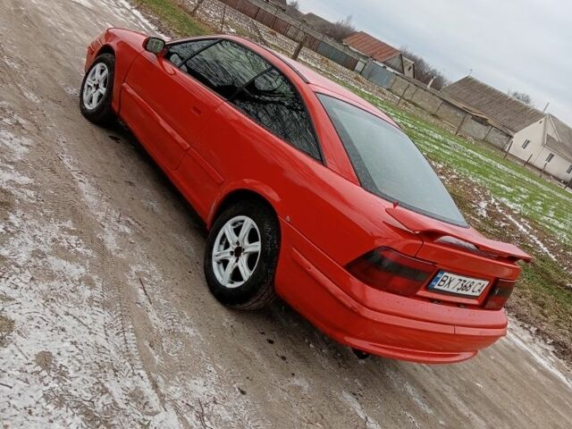 Красный Опель Калибра, объемом двигателя 2 л и пробегом 120 тыс. км за 1399 $, фото 4 на Automoto.ua