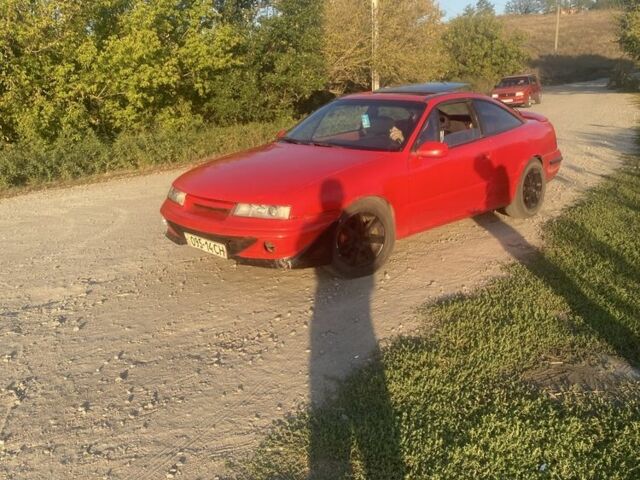 Красный Опель Калибра, объемом двигателя 2 л и пробегом 270 тыс. км за 1700 $, фото 5 на Automoto.ua