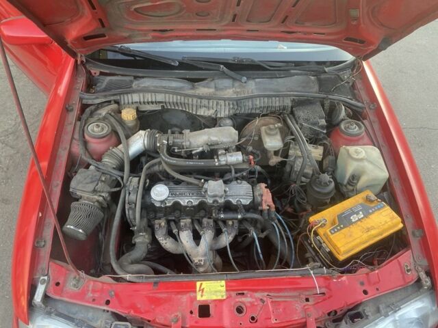 Красный Опель Калибра, объемом двигателя 2 л и пробегом 270 тыс. км за 1700 $, фото 7 на Automoto.ua