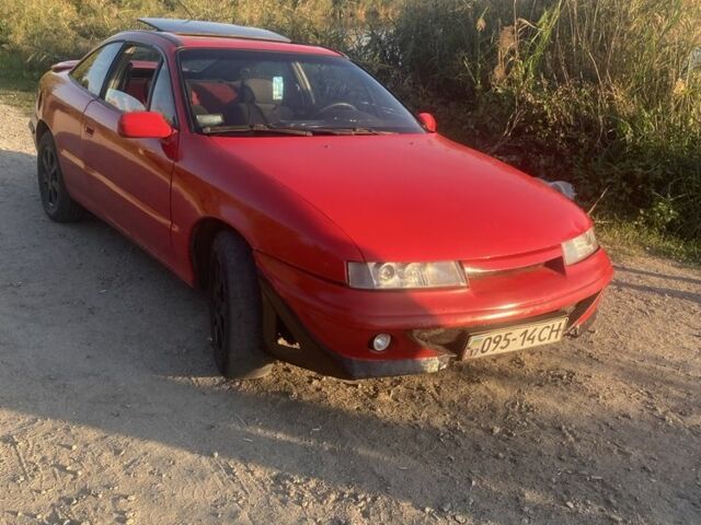 Красный Опель Калибра, объемом двигателя 2 л и пробегом 270 тыс. км за 1700 $, фото 3 на Automoto.ua