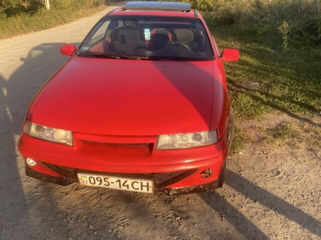 Красный Опель Калибра, объемом двигателя 2 л и пробегом 270 тыс. км за 1700 $, фото 4 на Automoto.ua