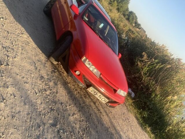 Красный Опель Калибра, объемом двигателя 2 л и пробегом 270 тыс. км за 1700 $, фото 1 на Automoto.ua
