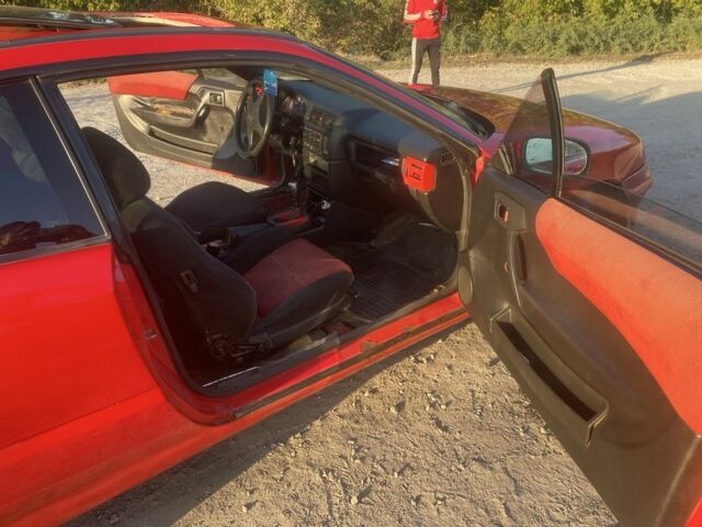 Красный Опель Калибра, объемом двигателя 2 л и пробегом 270 тыс. км за 1700 $, фото 6 на Automoto.ua