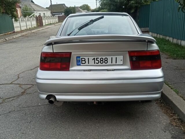 Сірий Опель Калібра, об'ємом двигуна 2 л та пробігом 317 тис. км за 2700 $, фото 9 на Automoto.ua