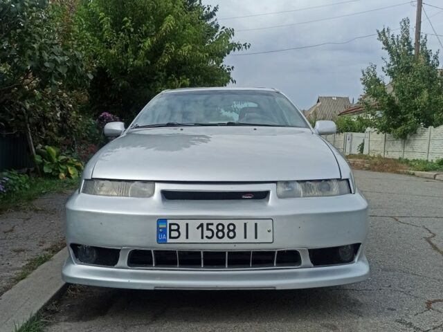 Сірий Опель Калібра, об'ємом двигуна 2 л та пробігом 317 тис. км за 2700 $, фото 12 на Automoto.ua