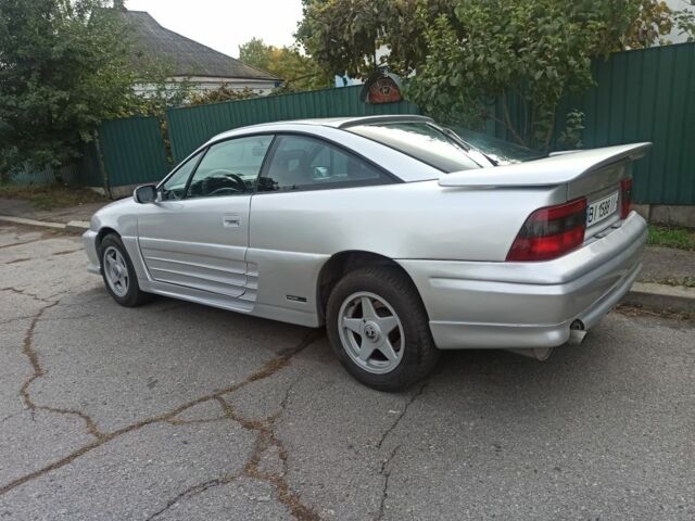 Сірий Опель Калібра, об'ємом двигуна 2 л та пробігом 317 тис. км за 2700 $, фото 8 на Automoto.ua