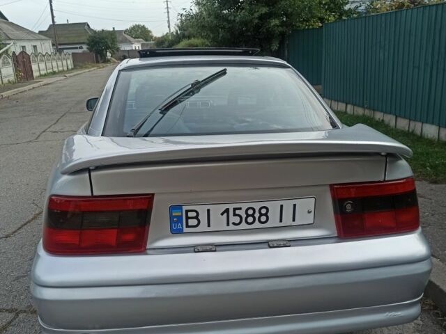 Сірий Опель Калібра, об'ємом двигуна 2 л та пробігом 317 тис. км за 2700 $, фото 4 на Automoto.ua