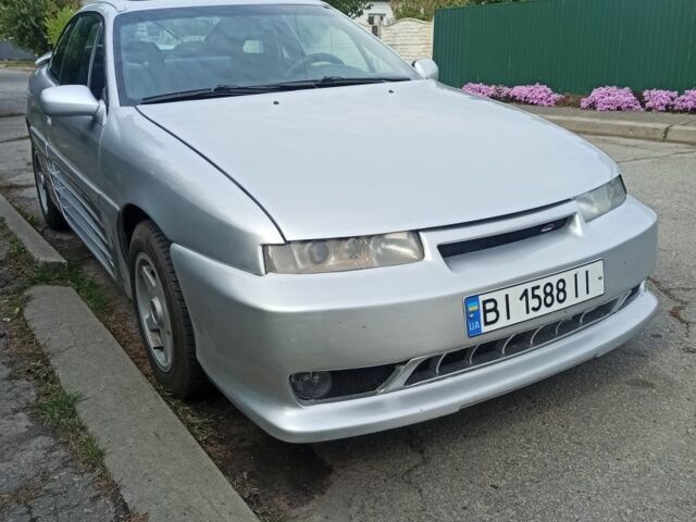 Сірий Опель Калібра, об'ємом двигуна 2 л та пробігом 317 тис. км за 2700 $, фото 11 на Automoto.ua