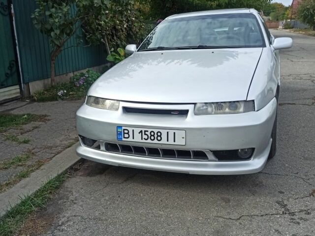 Сірий Опель Калібра, об'ємом двигуна 2 л та пробігом 317 тис. км за 2700 $, фото 7 на Automoto.ua