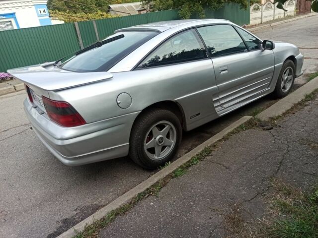 Сірий Опель Калібра, об'ємом двигуна 2 л та пробігом 317 тис. км за 2700 $, фото 2 на Automoto.ua