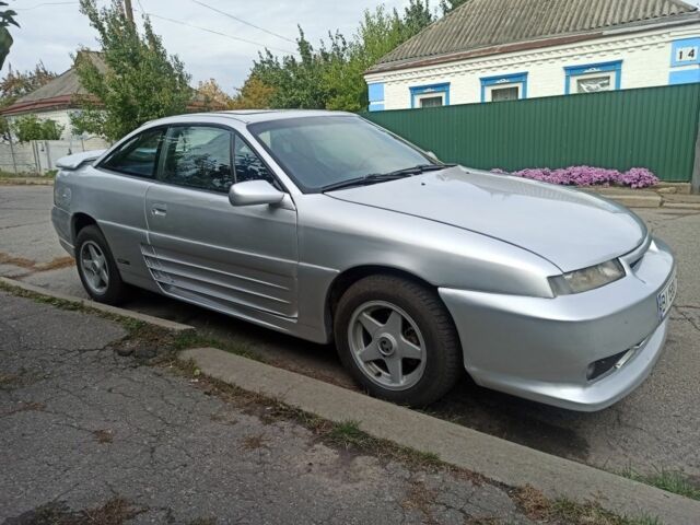 Сірий Опель Калібра, об'ємом двигуна 2 л та пробігом 317 тис. км за 2700 $, фото 3 на Automoto.ua