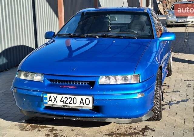 Синий Опель Калибра, объемом двигателя 2 л и пробегом 280 тыс. км за 2500 $, фото 2 на Automoto.ua