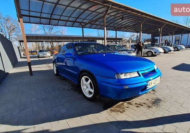 Синий Опель Калибра, объемом двигателя 2 л и пробегом 280 тыс. км за 2500 $, фото 6 на Automoto.ua