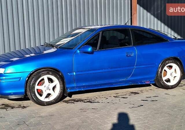 Синий Опель Калибра, объемом двигателя 2 л и пробегом 280 тыс. км за 2500 $, фото 5 на Automoto.ua