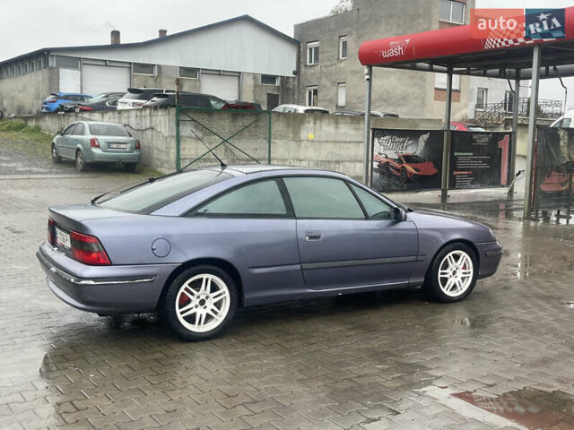 Синій Опель Калібра, об'ємом двигуна 3.2 л та пробігом 170 тис. км за 4300 $, фото 13 на Automoto.ua