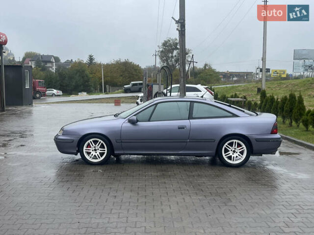 Синій Опель Калібра, об'ємом двигуна 3.2 л та пробігом 170 тис. км за 4500 $, фото 4 на Automoto.ua