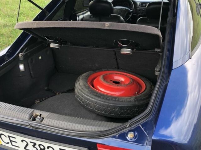 Синий Опель Калибра, объемом двигателя 2 л и пробегом 300 тыс. км за 3000 $, фото 6 на Automoto.ua