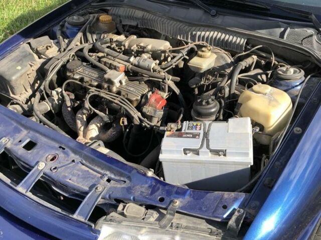 Синий Опель Калибра, объемом двигателя 2 л и пробегом 300 тыс. км за 3000 $, фото 4 на Automoto.ua