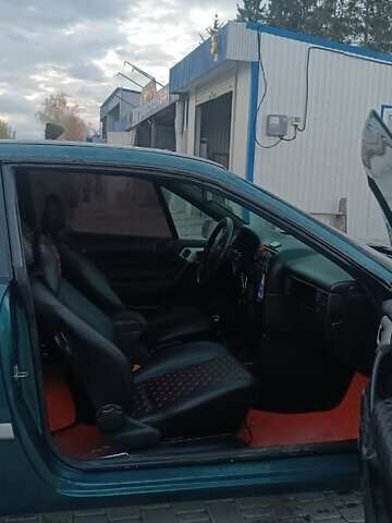 Зеленый Опель Калибра, объемом двигателя 2 л и пробегом 365 тыс. км за 2200 $, фото 3 на Automoto.ua