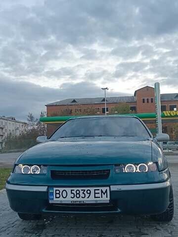 Зеленый Опель Калибра, объемом двигателя 2 л и пробегом 365 тыс. км за 2200 $, фото 2 на Automoto.ua