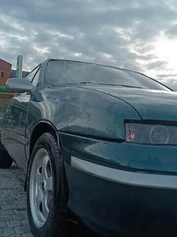 Зеленый Опель Калибра, объемом двигателя 2 л и пробегом 365 тыс. км за 2200 $, фото 1 на Automoto.ua