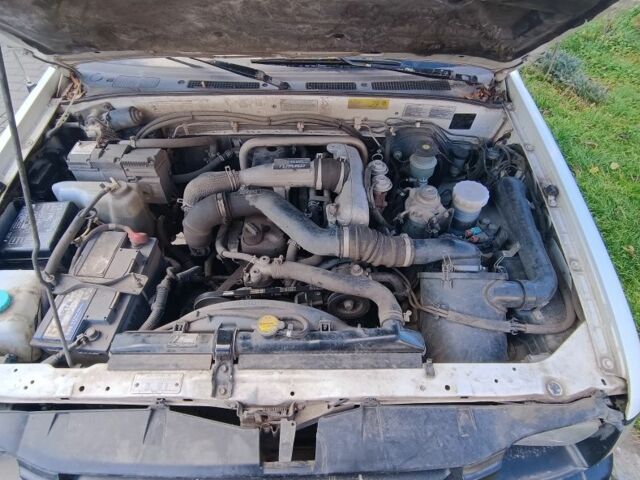 Белый Опель Кампо, объемом двигателя 3.1 л и пробегом 211 тыс. км за 3810 $, фото 6 на Automoto.ua