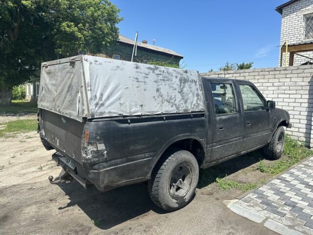 Черный Опель Кампо, объемом двигателя 3 л и пробегом 300 тыс. км за 85000 $, фото 2 на Automoto.ua