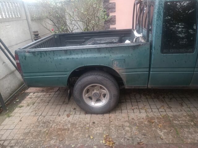 Зеленый Опель Кампо, объемом двигателя 2 л и пробегом 299 тыс. км за 2386 $, фото 2 на Automoto.ua