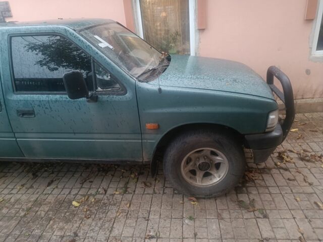 Зеленый Опель Кампо, объемом двигателя 2 л и пробегом 299 тыс. км за 2386 $, фото 1 на Automoto.ua