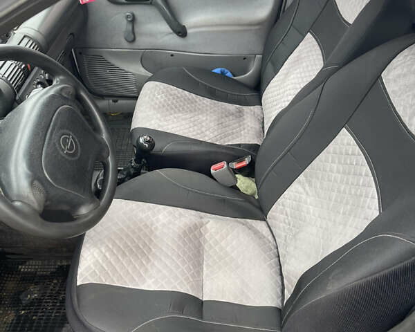 Белый Опель Комбо груз.-пасс., объемом двигателя 1.4 л и пробегом 383 тыс. км за 1300 $, фото 11 на Automoto.ua