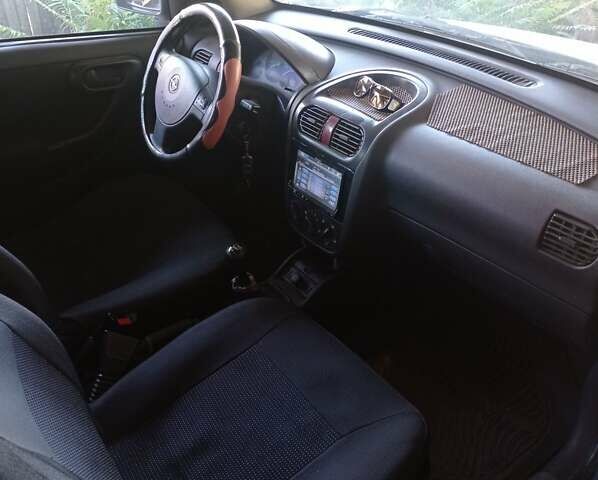 Белый Опель Комбо груз.-пасс., объемом двигателя 1.2 л и пробегом 350 тыс. км за 3800 $, фото 4 на Automoto.ua