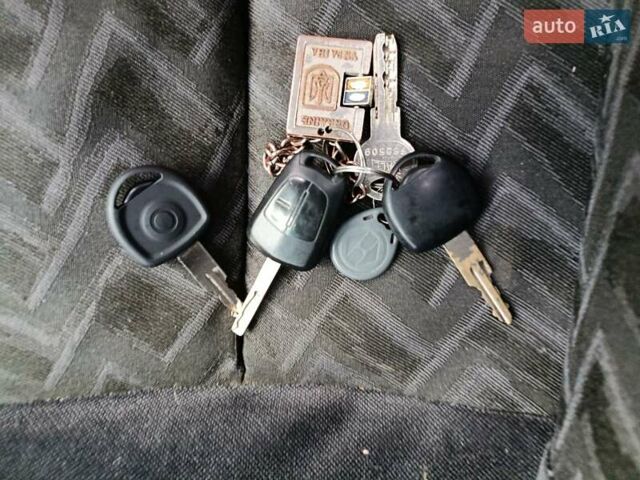 Белый Опель Комбо груз.-пасс., объемом двигателя 1.25 л и пробегом 286 тыс. км за 3500 $, фото 4 на Automoto.ua