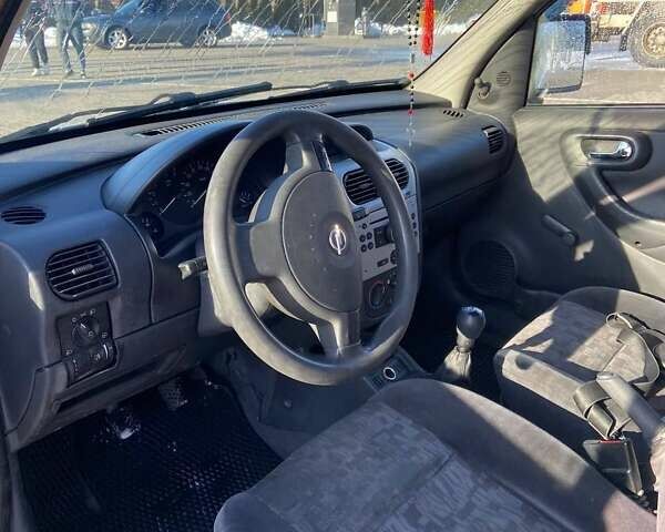 Белый Опель Комбо груз.-пасс., объемом двигателя 1.25 л и пробегом 390 тыс. км за 4350 $, фото 8 на Automoto.ua