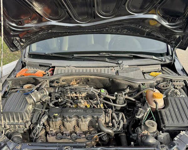 Черный Опель Комбо груз.-пасс., объемом двигателя 2 л и пробегом 334 тыс. км за 3500 $, фото 8 на Automoto.ua