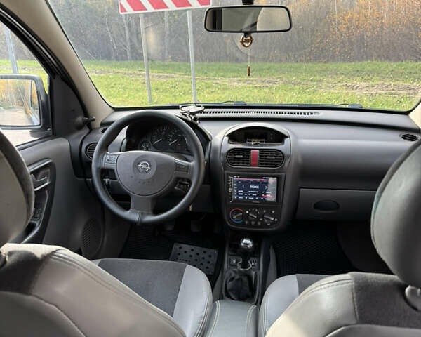 Черный Опель Комбо груз.-пасс., объемом двигателя 2 л и пробегом 334 тыс. км за 3500 $, фото 4 на Automoto.ua