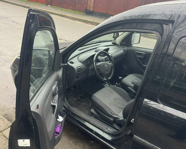 Черный Опель Комбо груз.-пасс., объемом двигателя 1.25 л и пробегом 130 тыс. км за 4200 $, фото 9 на Automoto.ua