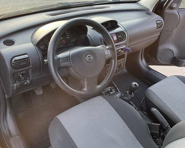 Черный Опель Комбо груз.-пасс., объемом двигателя 1.3 л и пробегом 177 тыс. км за 5600 $, фото 6 на Automoto.ua