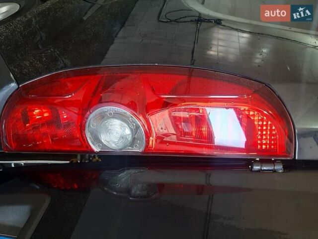 Черный Опель Комбо груз.-пасс., объемом двигателя 1.25 л и пробегом 316 тыс. км за 5000 $, фото 7 на Automoto.ua