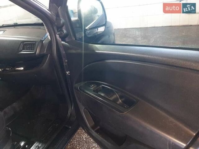 Черный Опель Комбо груз.-пасс., объемом двигателя 1.25 л и пробегом 316 тыс. км за 5000 $, фото 11 на Automoto.ua