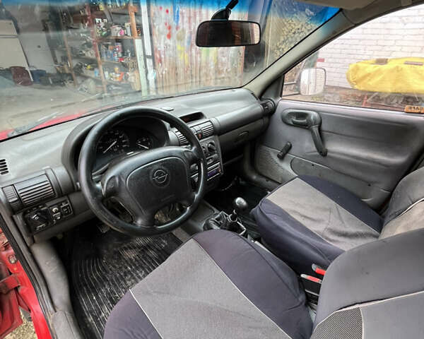 Красный Опель Комбо груз.-пасс., объемом двигателя 1.4 л и пробегом 438 тыс. км за 2000 $, фото 24 на Automoto.ua