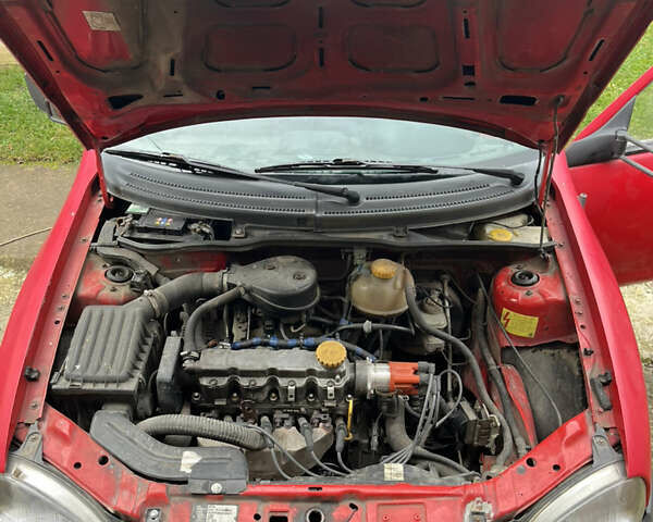 Красный Опель Комбо груз.-пасс., объемом двигателя 1.4 л и пробегом 438 тыс. км за 2000 $, фото 26 на Automoto.ua