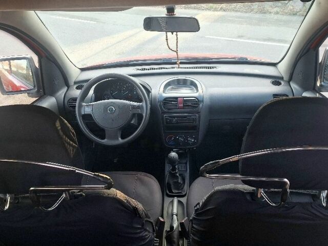 Красный Опель Комбо груз.-пасс., объемом двигателя 1.2 л и пробегом 246 тыс. км за 3699 $, фото 4 на Automoto.ua