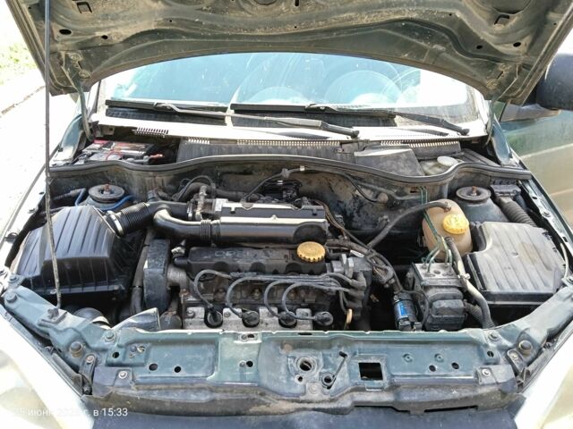 Зеленый Опель Комбо груз.-пасс., объемом двигателя 1.6 л и пробегом 368 тыс. км за 2600 $, фото 4 на Automoto.ua