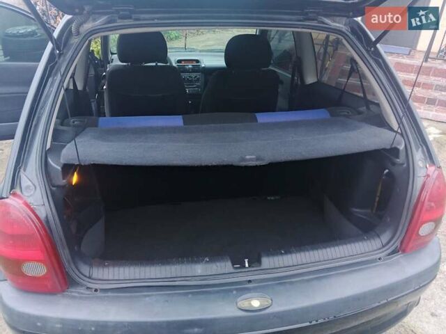 Черный Опель Корса, объемом двигателя 1.2 л и пробегом 235 тыс. км за 2200 $, фото 10 на Automoto.ua