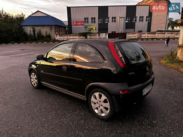 Чорний Опель Корса, об'ємом двигуна 1.23 л та пробігом 328 тис. км за 3100 $, фото 6 на Automoto.ua